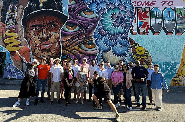Immersion group in Miami in front of mural